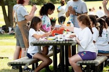 campers painting at table