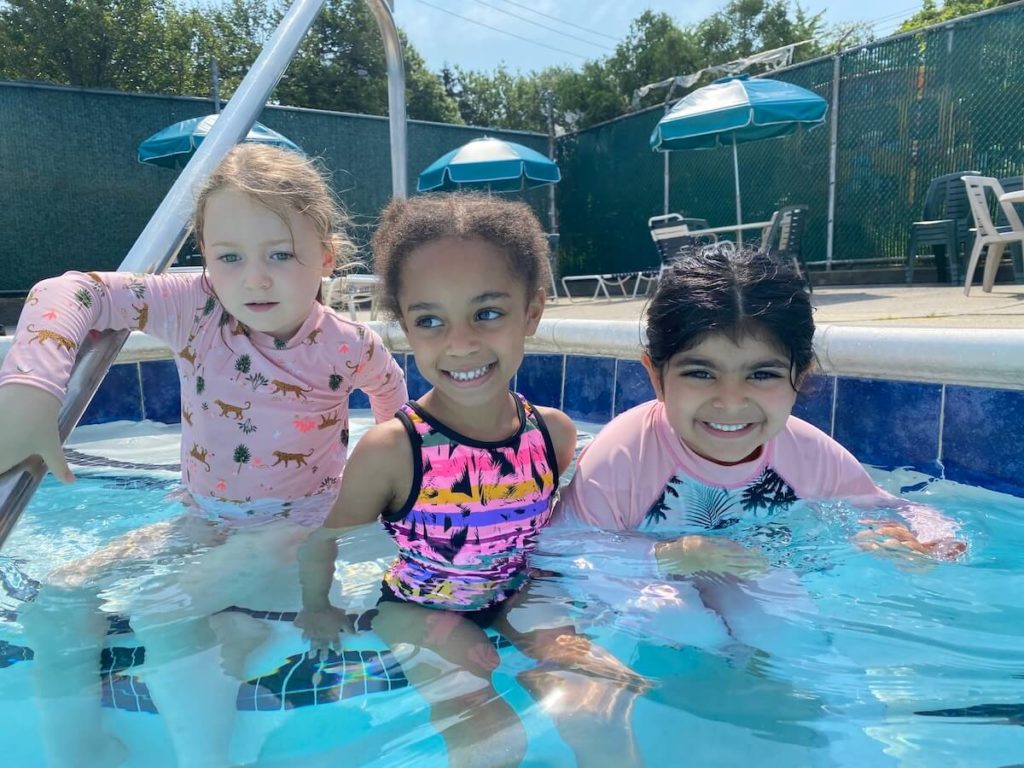 children smiling in pool
