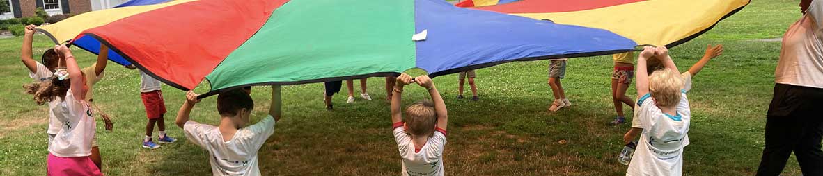campers playing with parachute
