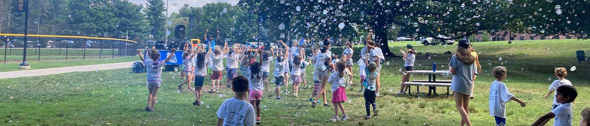campers playing in bubbles